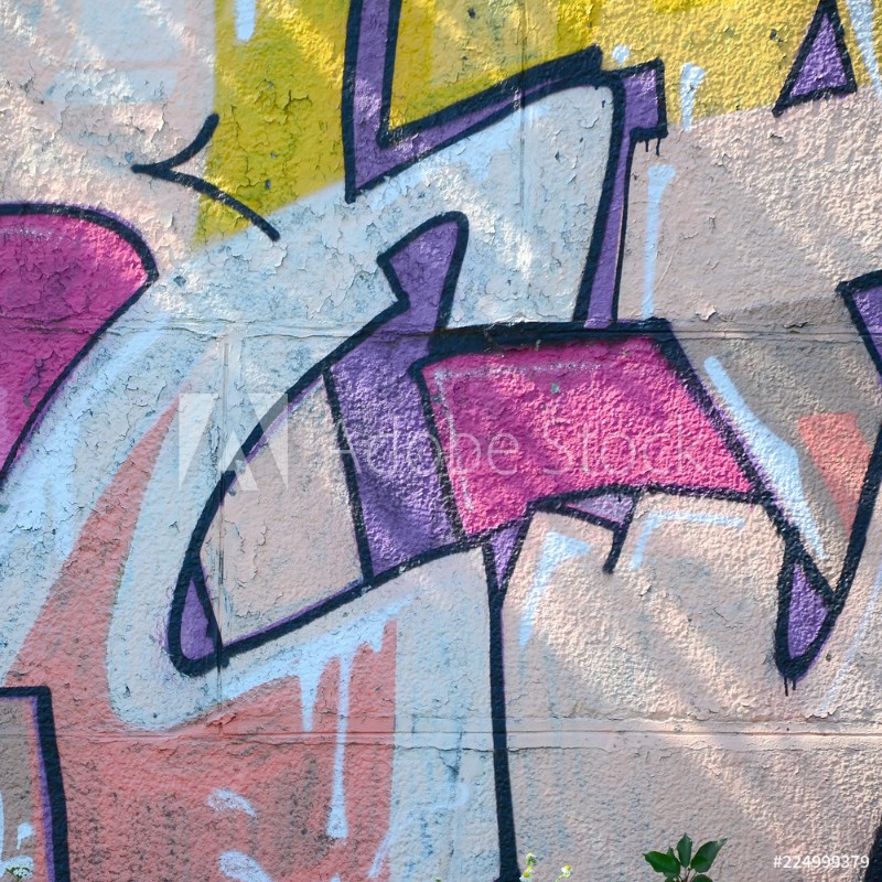 Picture of Fragment of graffiti drawings The old wall decorated with paint stains in the style of street art culture Colored background texture in warm tones